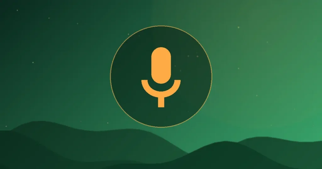 A microphone in front of a phone on a small tripod